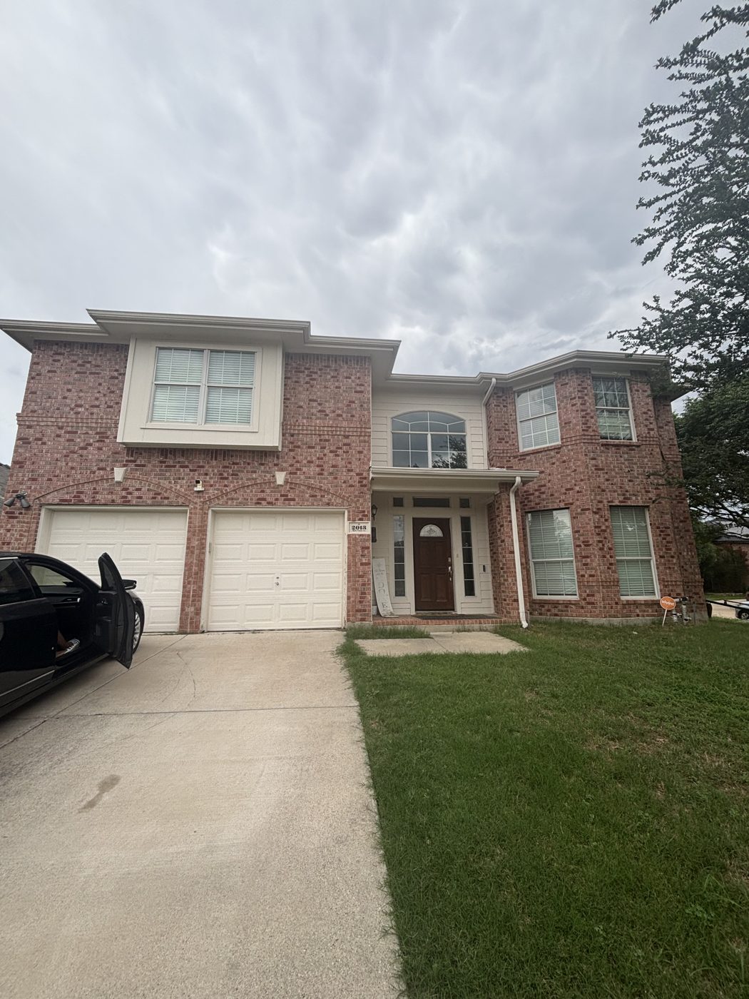Two-story brick home bought for cash in Denton, TX